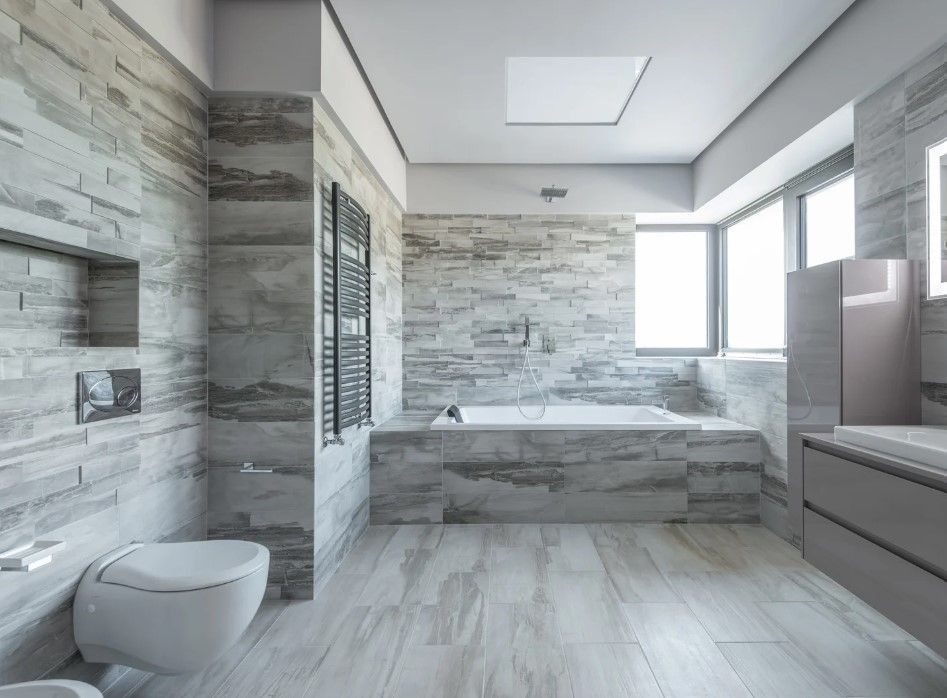 renovated bathroom with floor to ceiling tiling