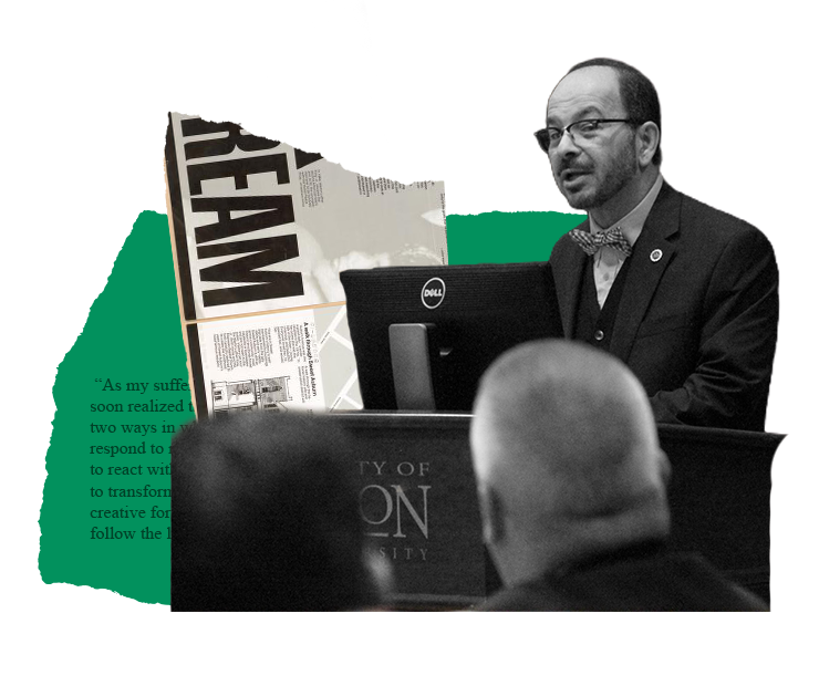 Man speaking at a podium with a newspaper cutout that says