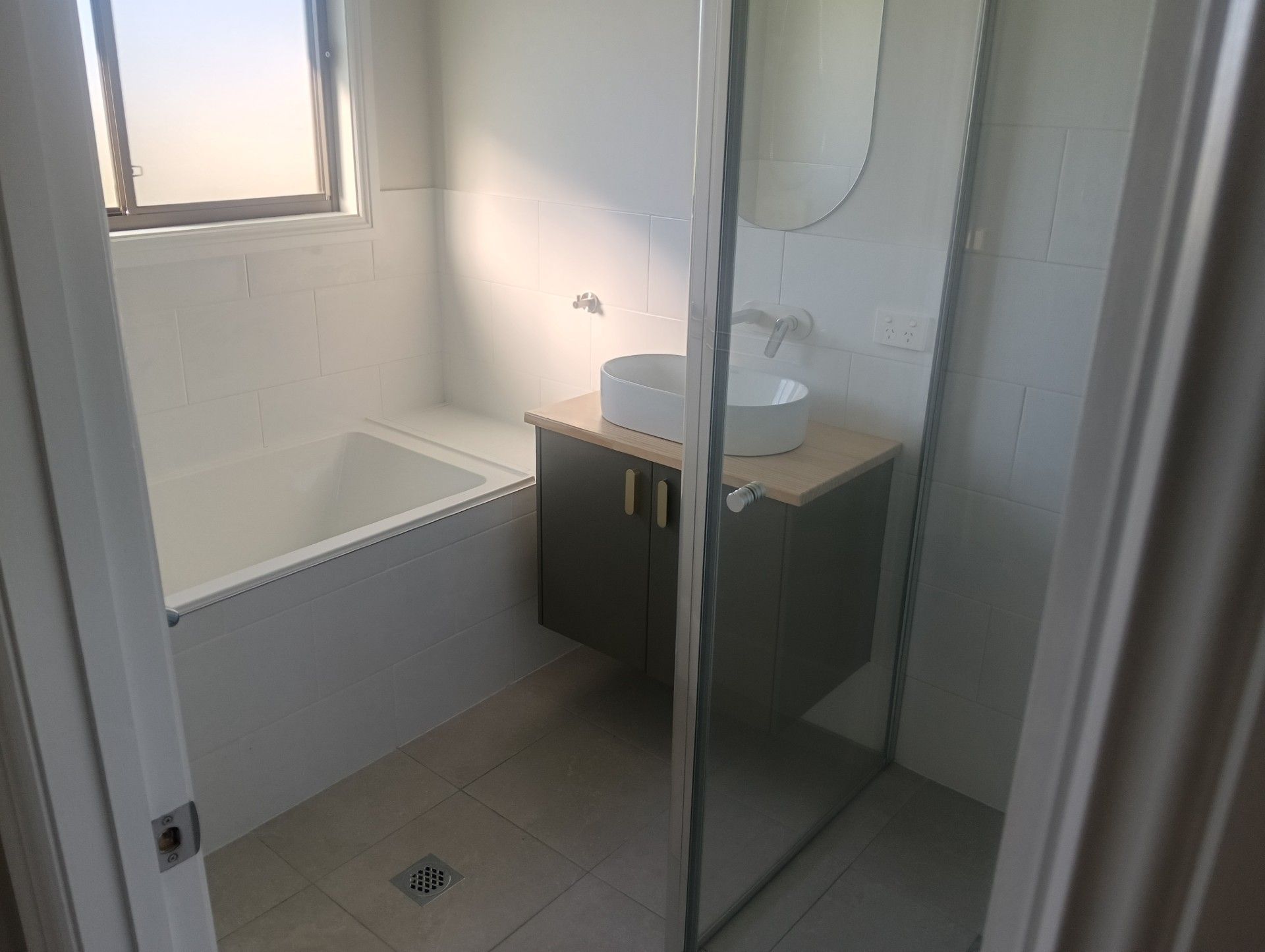 Completed bathroom renovation by Gawthorne Builders showing modern finish and quality tiles