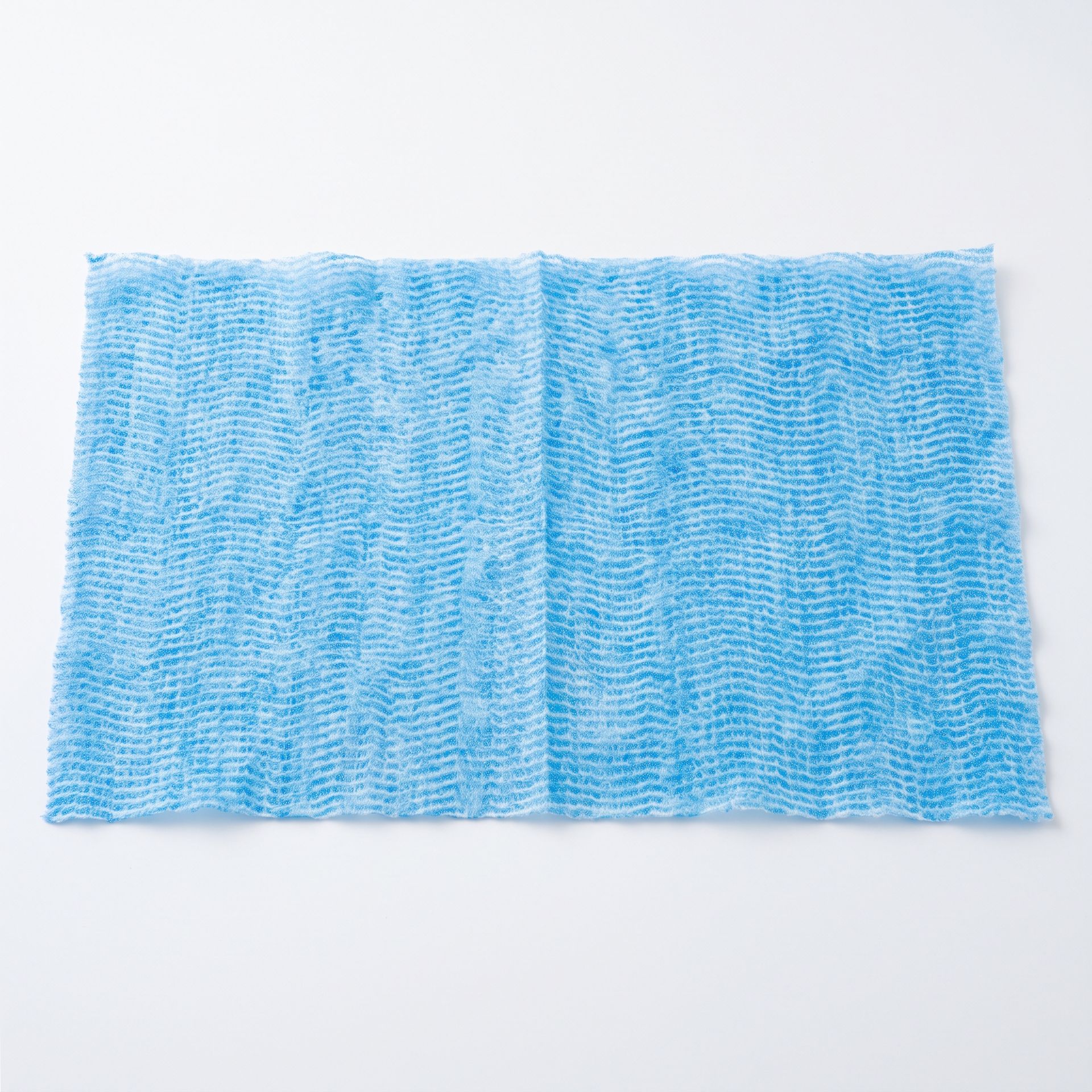 Light blue textured cloth laid flat on a white background