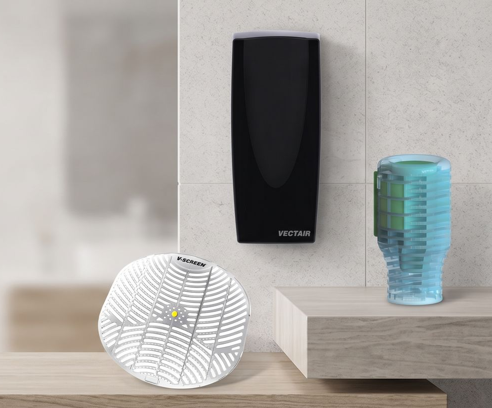 Modern shelf with black wall dispenser, white patterned decor, and blue glass vase on wood surface