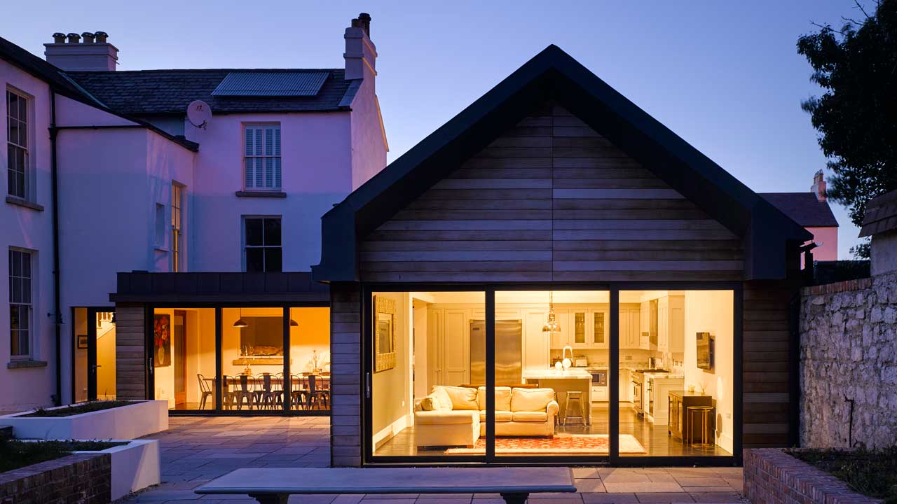 Timber cladding at a remodelled and extended protected structure.