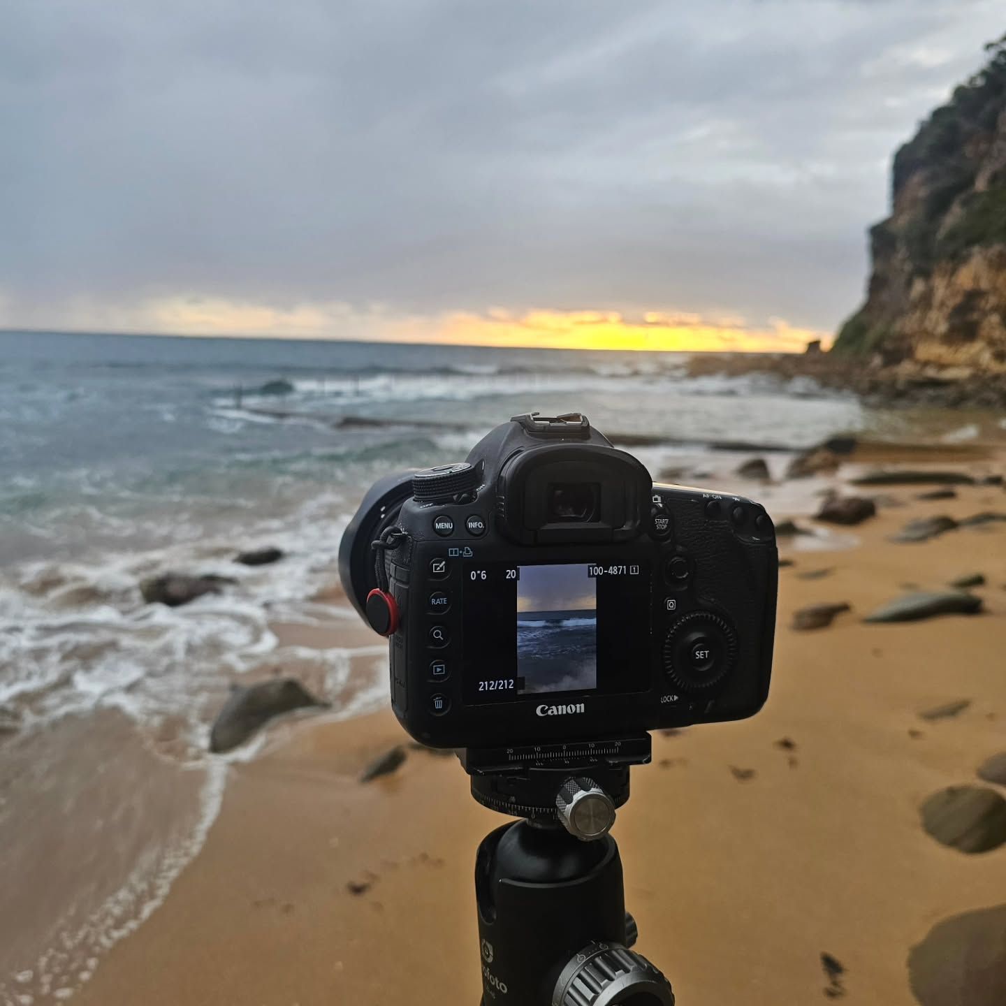Camera on Tripod at A Sandy Beach, Facing the Ocean at Sunset with Cliffs on The Right — Craig Stevens Photography in Pearl Beach, NSW