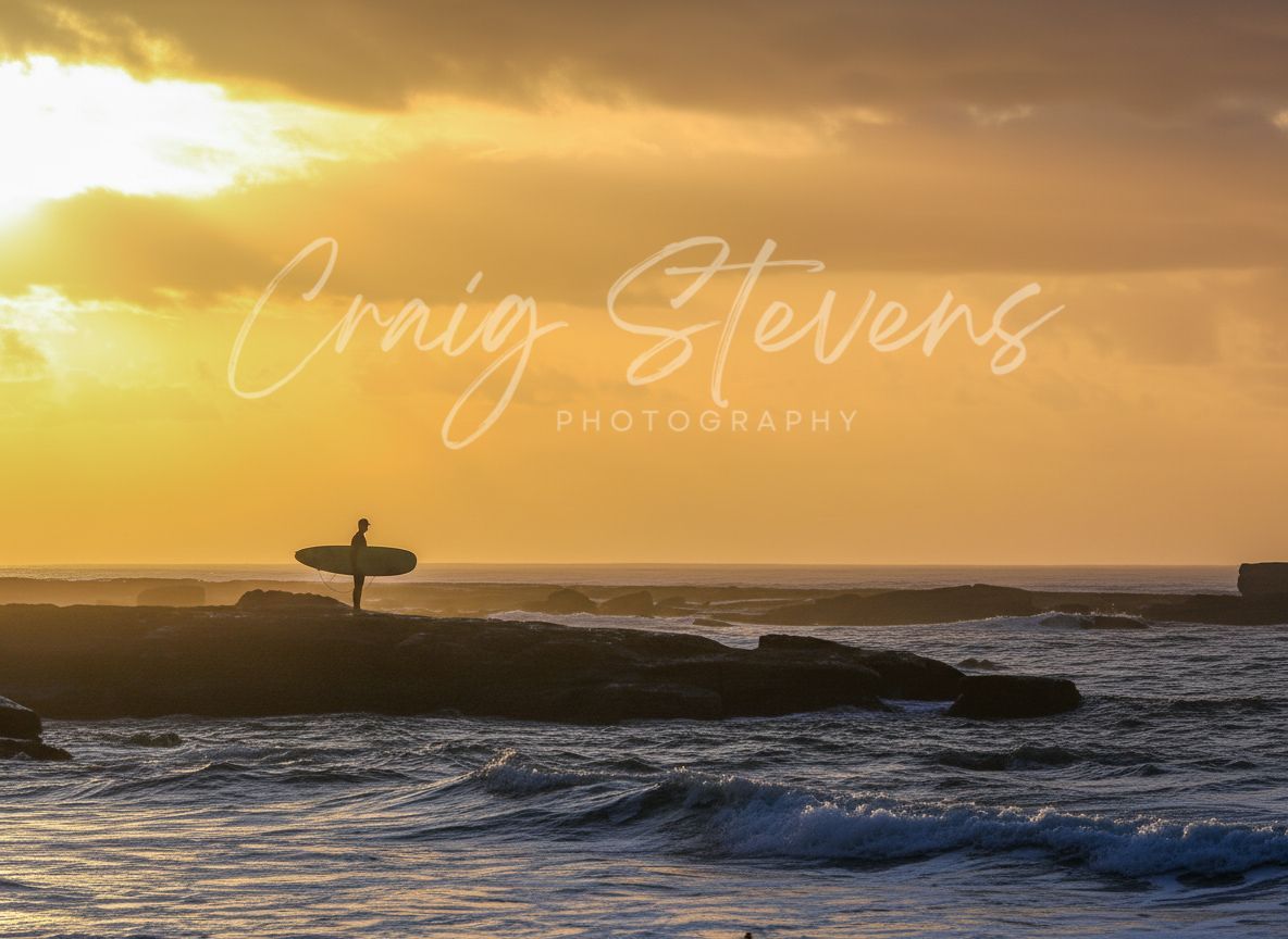 Silhouette Of A Surfer On A Board At Sunset Over Ocean Waves — Craig Stevens Photography in Pearl Beach, NSW