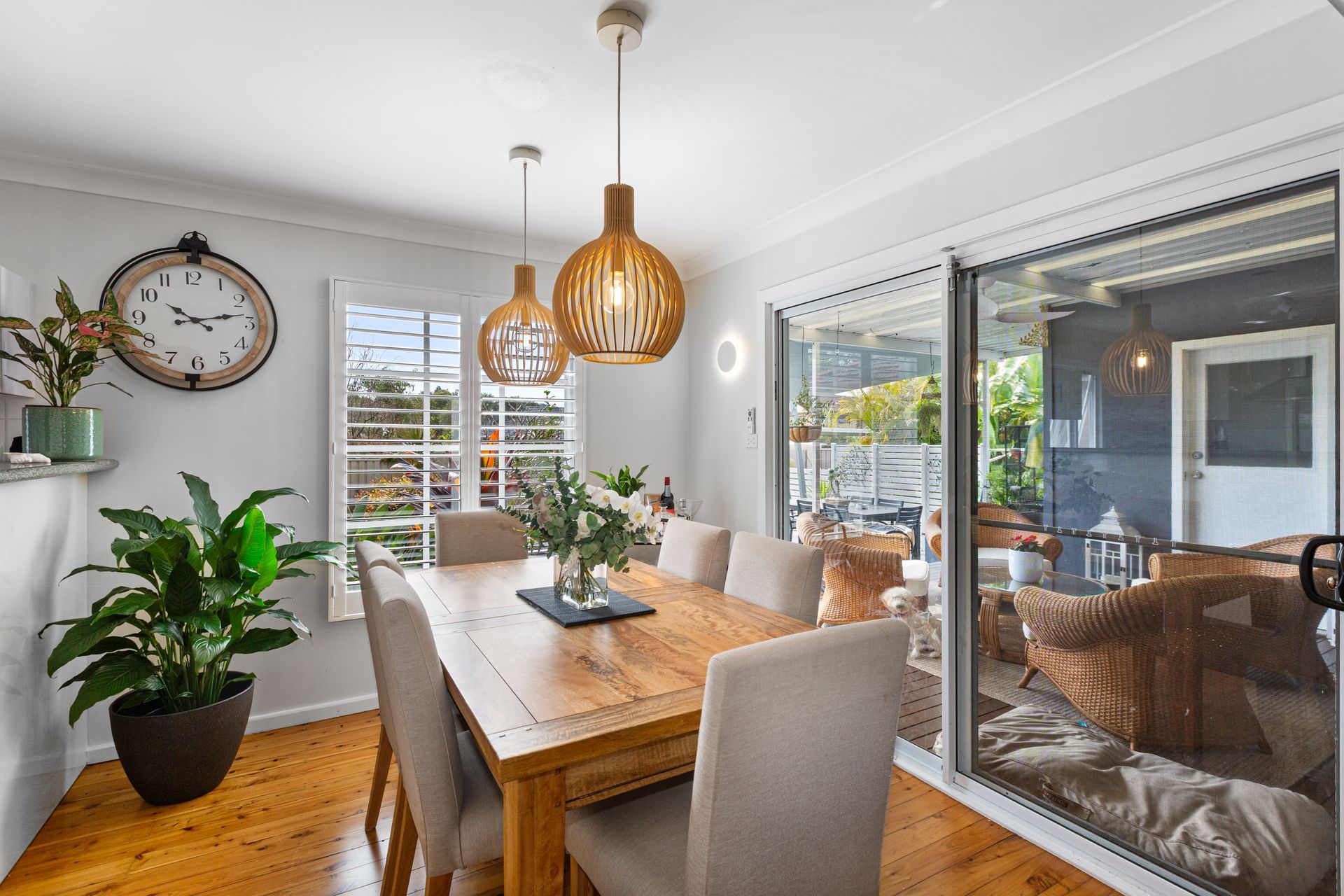 Bright Dining Room With Wooden Table, Beige Chairs, Plants — Craig Stevens Photography in Sydney, NSW