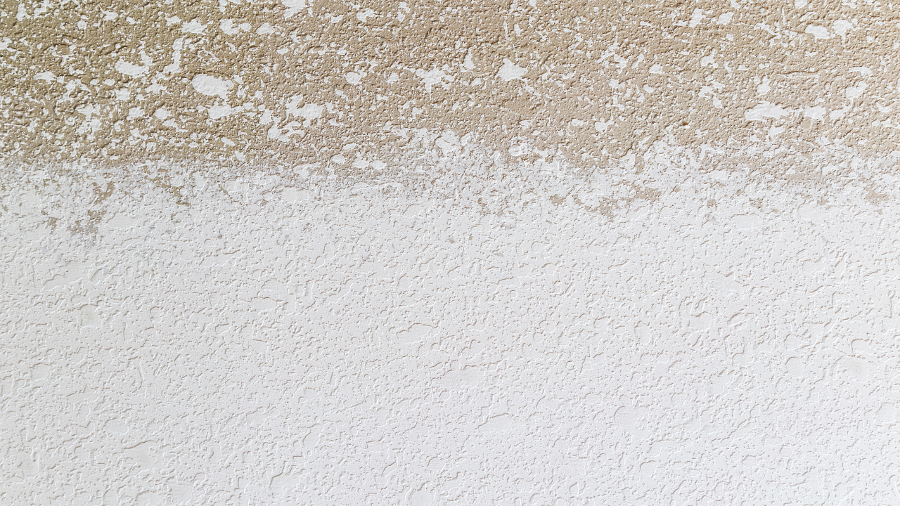 Beige and white textured wall with a clear color separation.