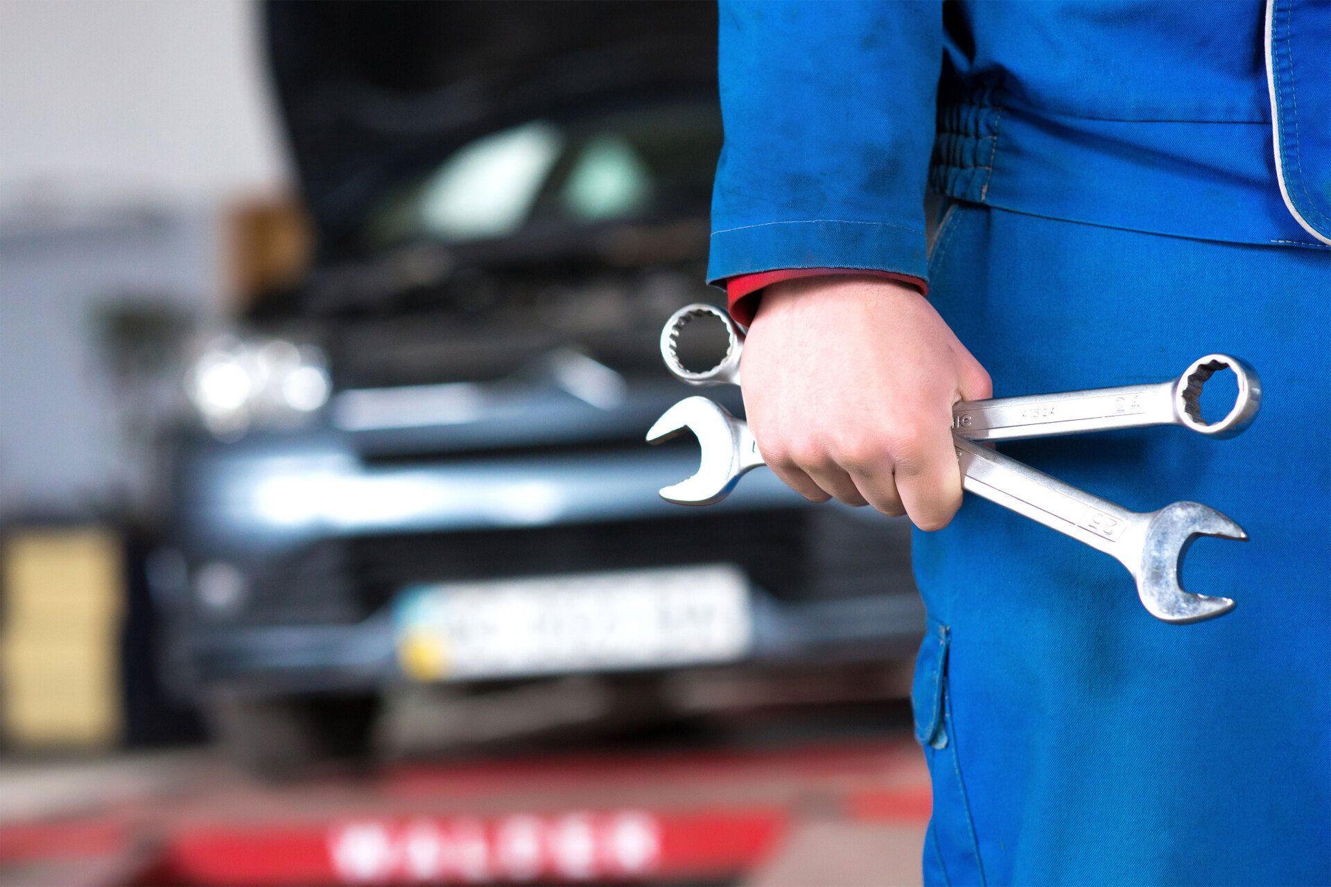 Technician holding wrenches