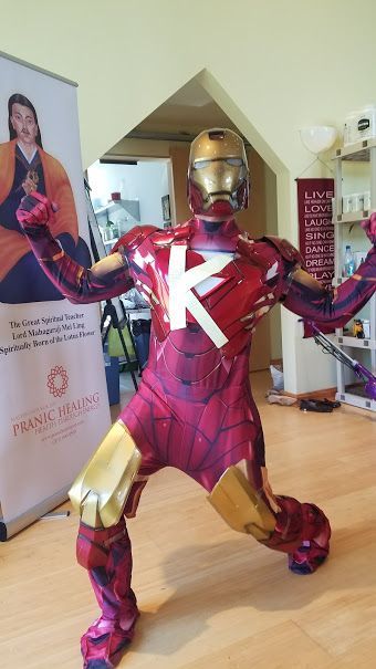 A person wearing a homemade Iron Man costume with a large white 