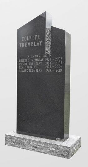 Pierre tombale en granit noir avec noms et dates.