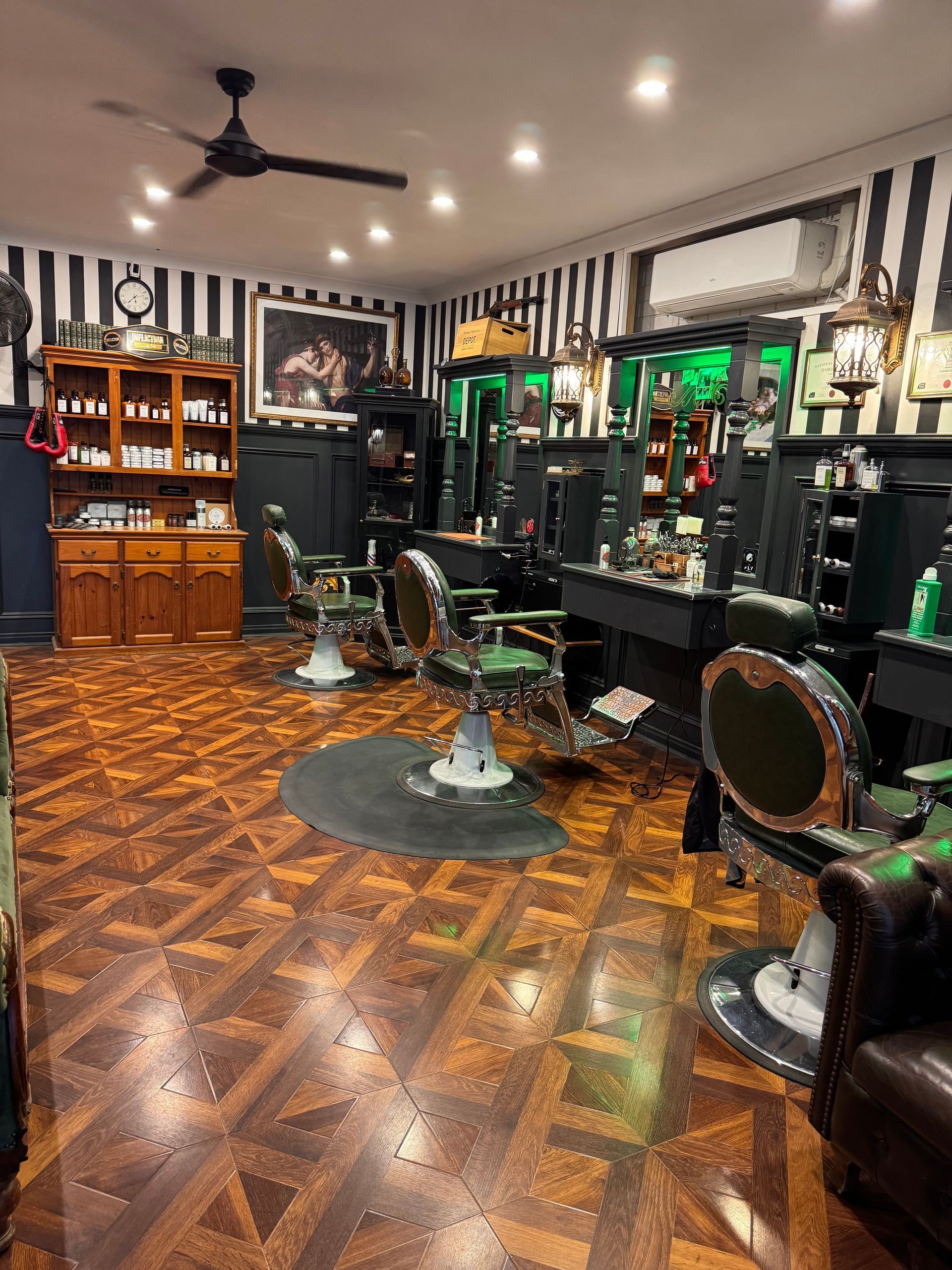 A Person is Holding a Cell Phone With a Picture of a Child on It — Connolly & Co Barbers In Robina, QLD