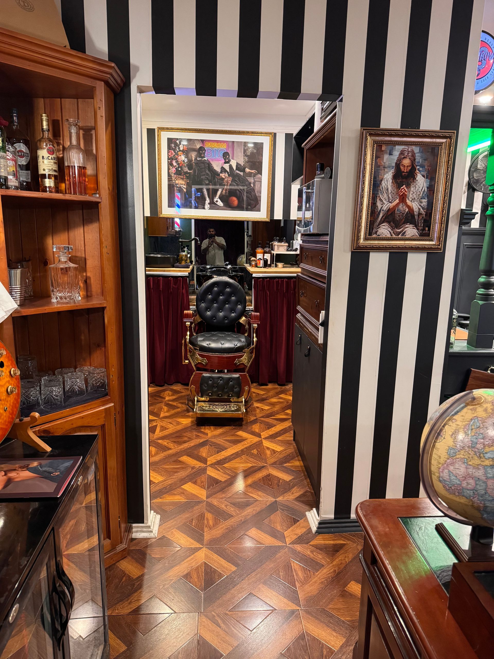 A Man is Getting His Hair Cut by a Barber in a Barber Shop — Connolly & Co Barbers In Robina, QLD