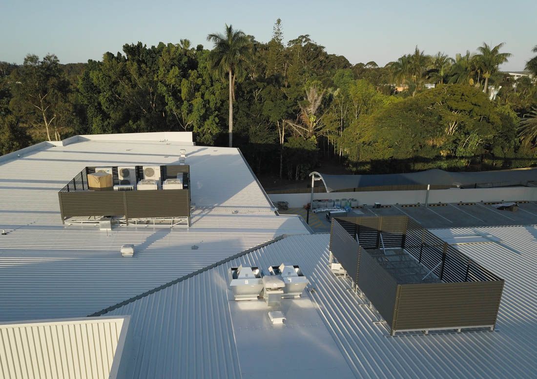 HVAC decks with screens installed on the rooftop - aerial photo
