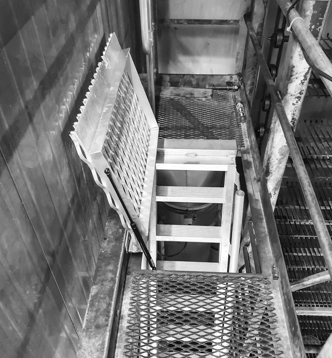 Indoor stairs access hatch for storage facility