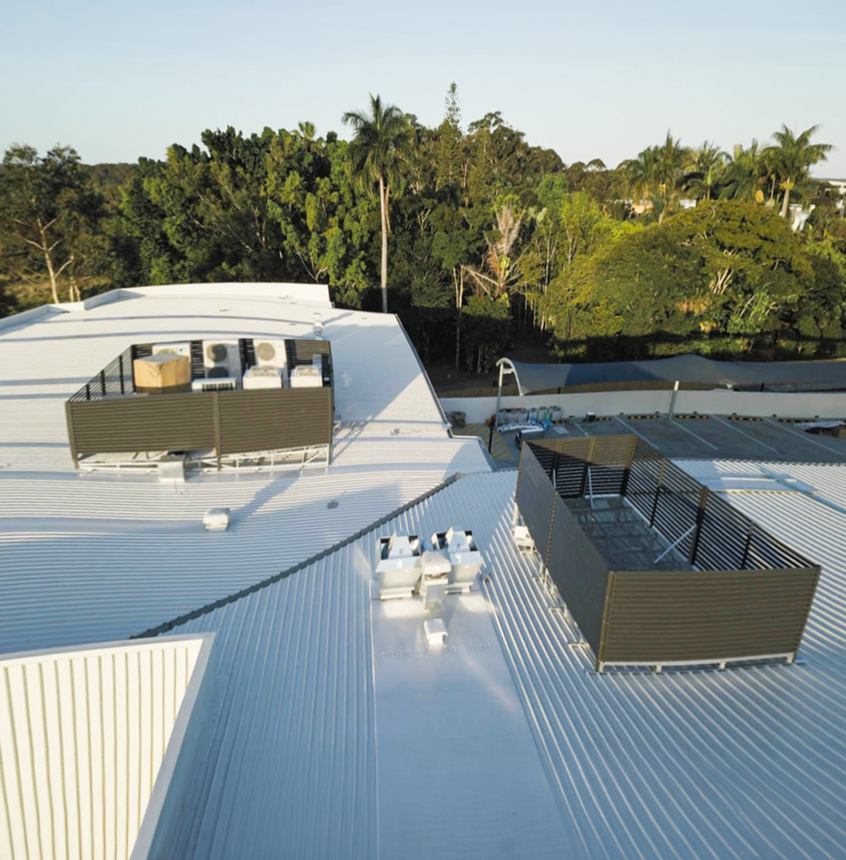Plant platforms with screens for HVAC maintenance access installed on the roof 