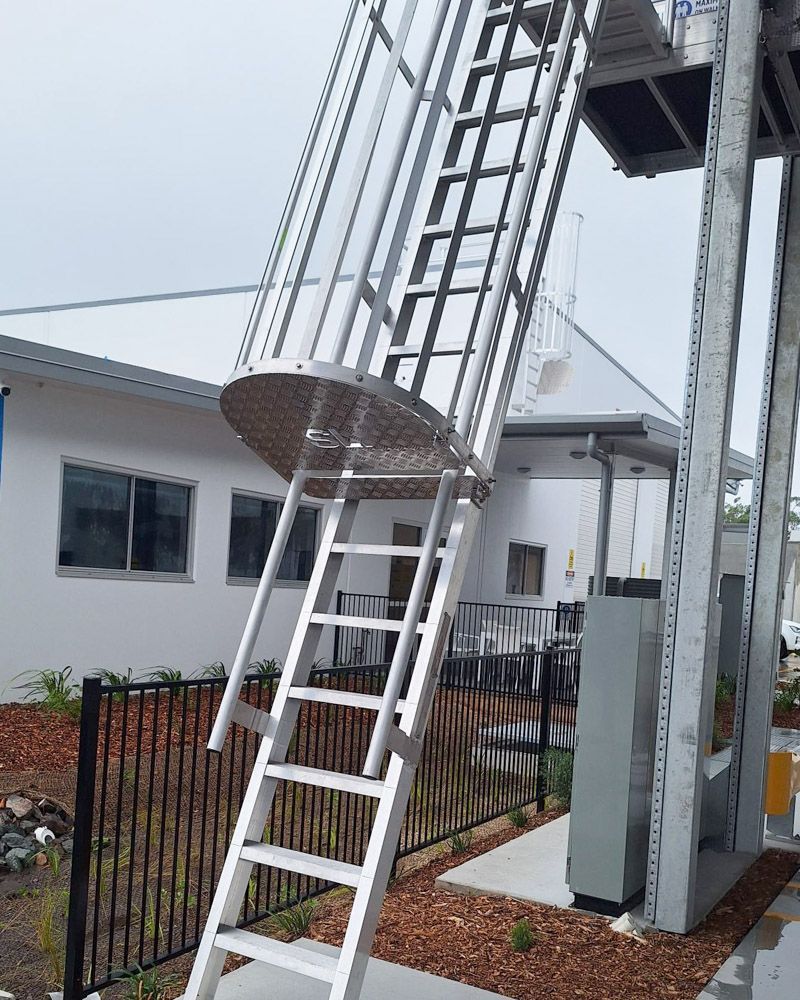 caged ladder access to the roof maintenance area