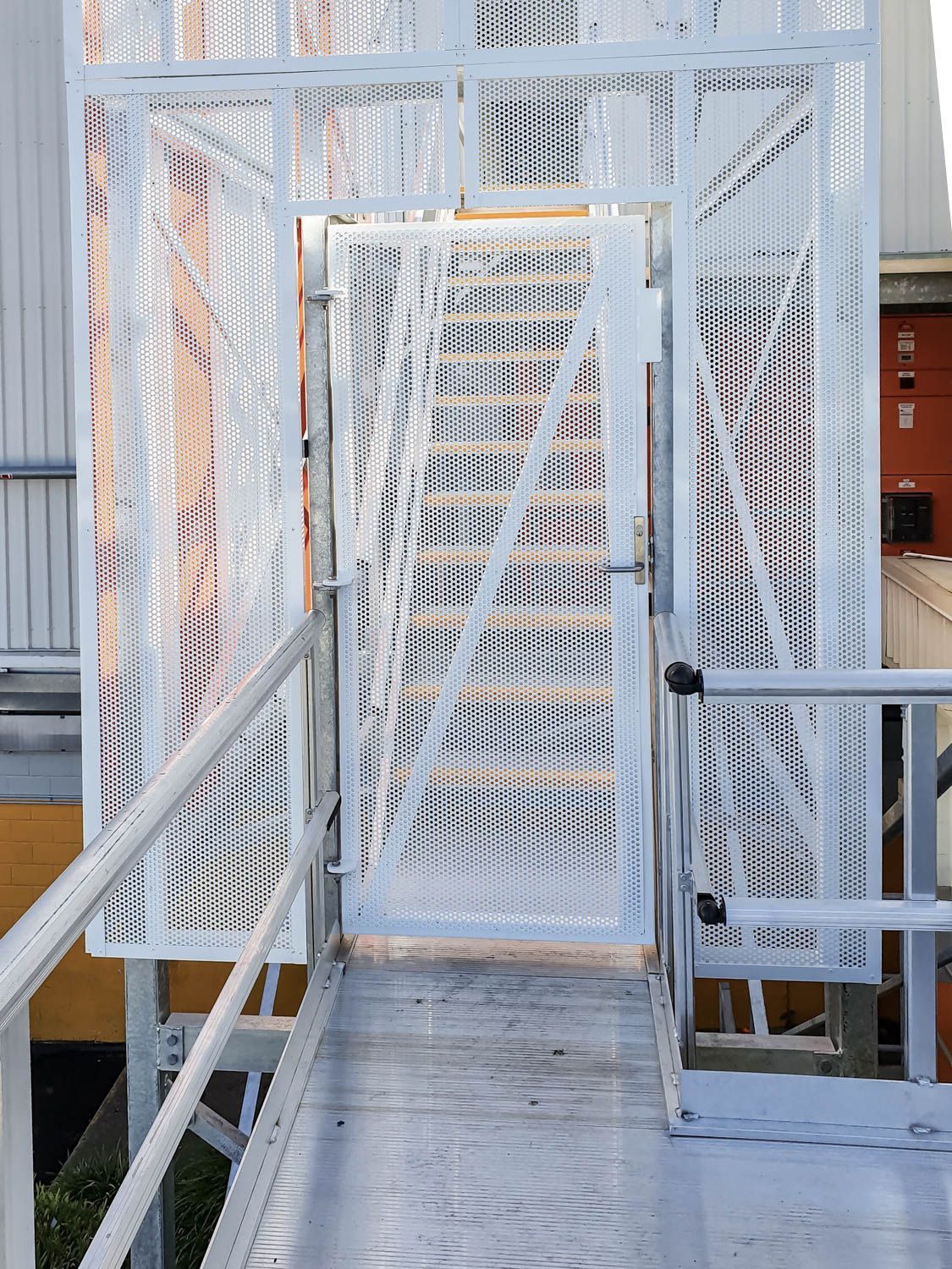 Secure Gates Access with a custom-made caged door and stairs to stair tower installed at cold storage facility 