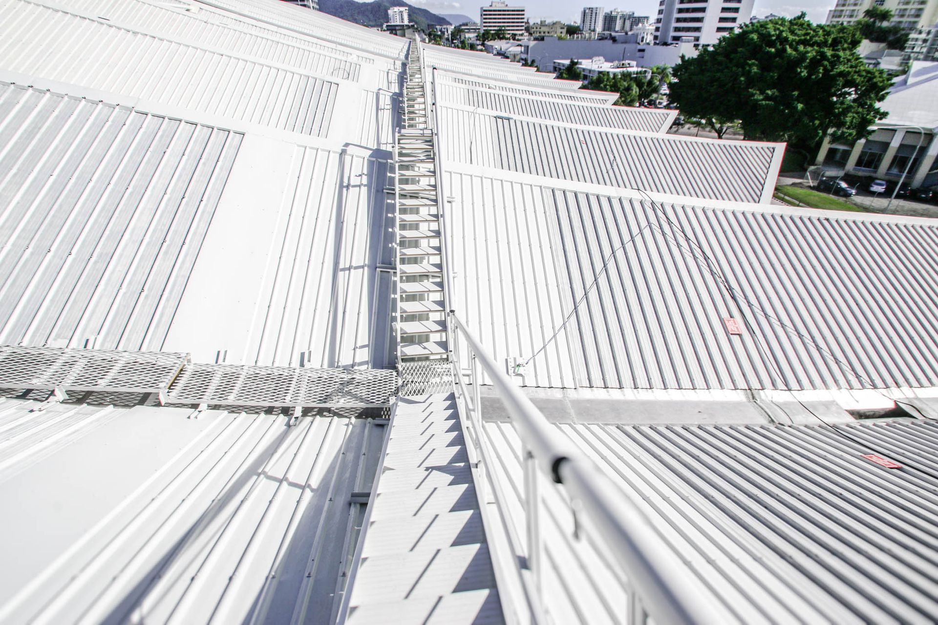 foldable guardrail for unusual roof shape to suit building design aesthetic