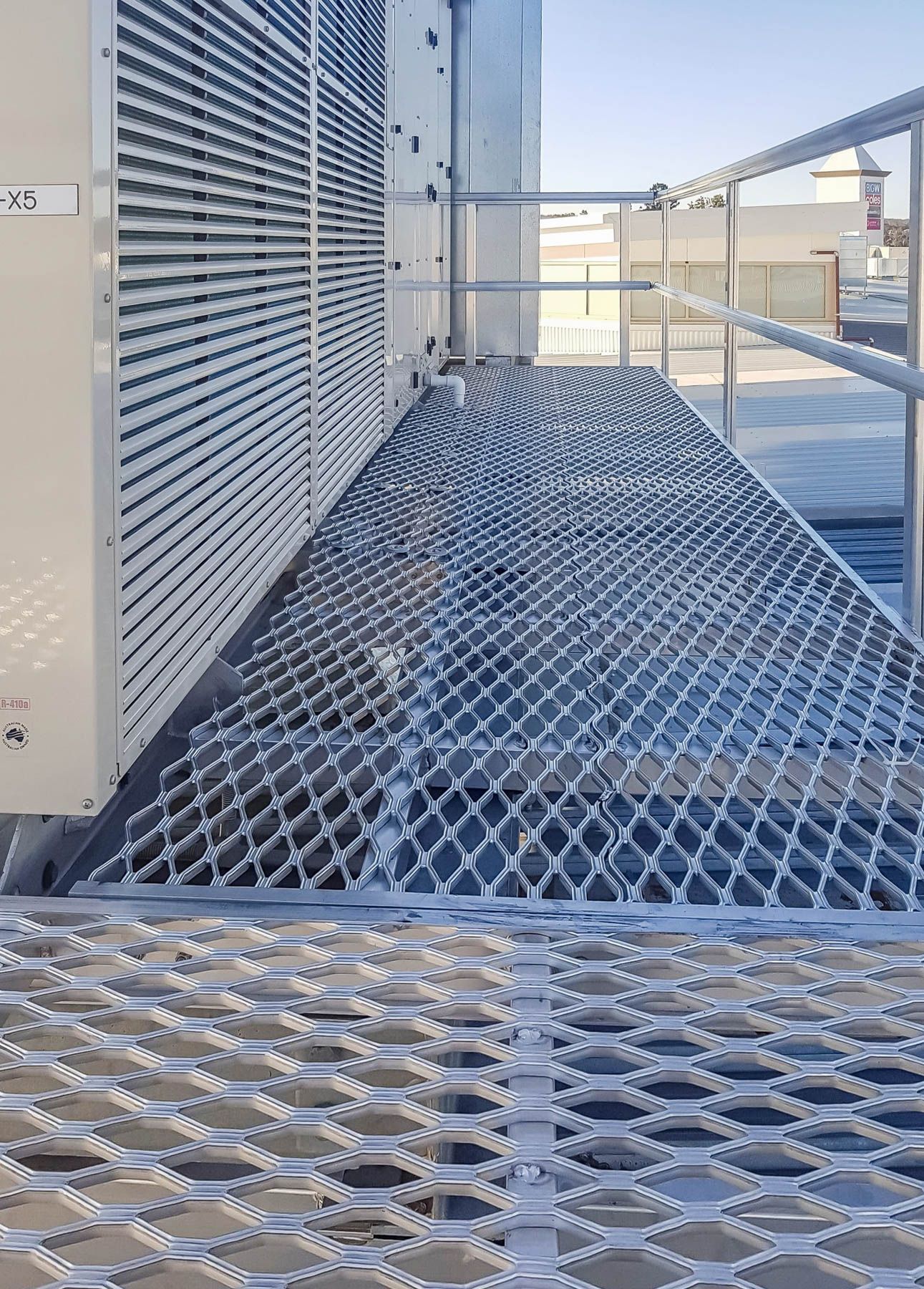 Grating deck walkway for elevated area access