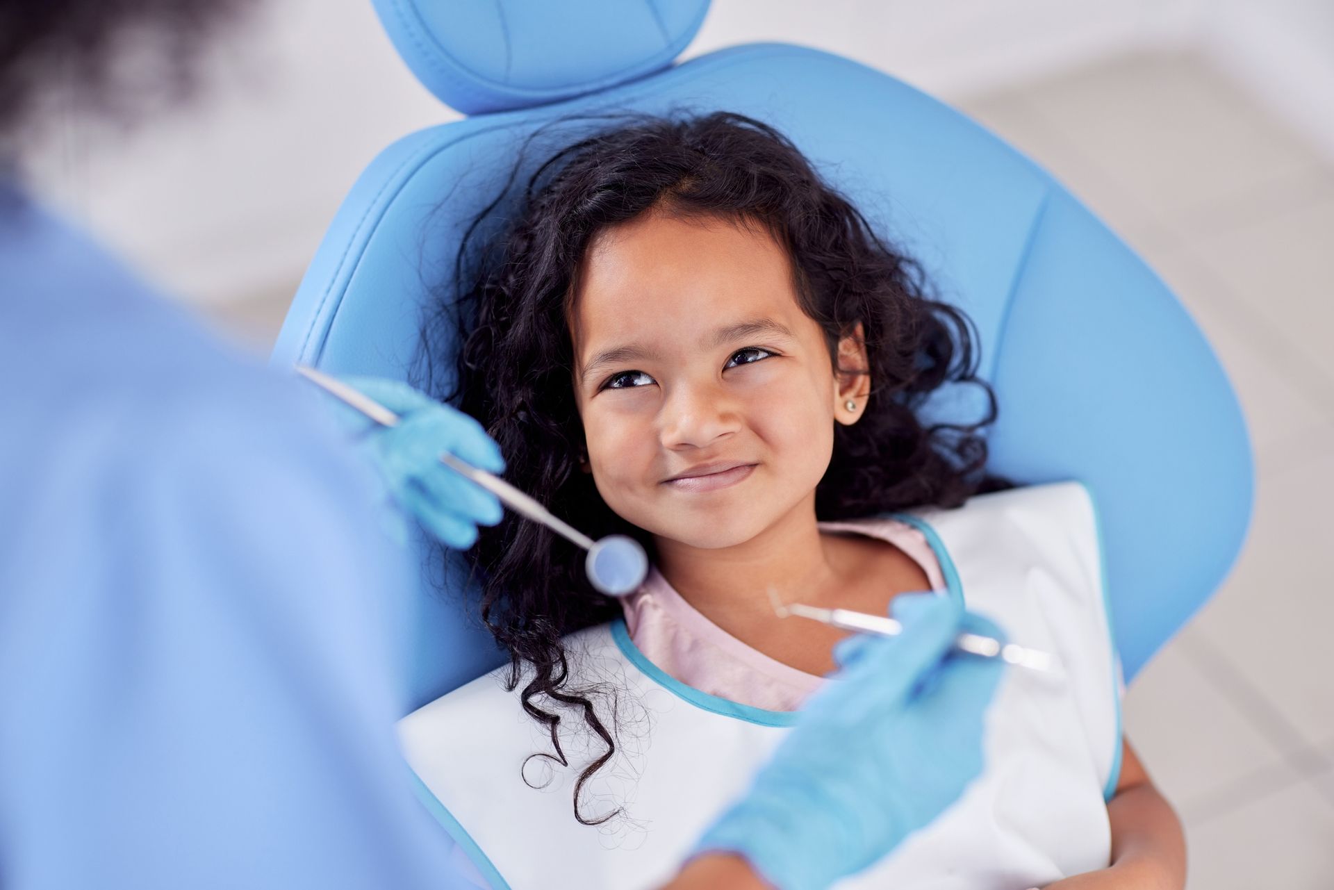 An adorable little girl having dental work done on her teeth.
