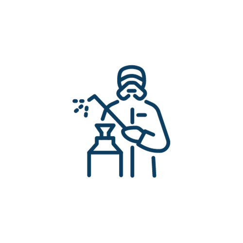 A man is welding a bottle with a torch.