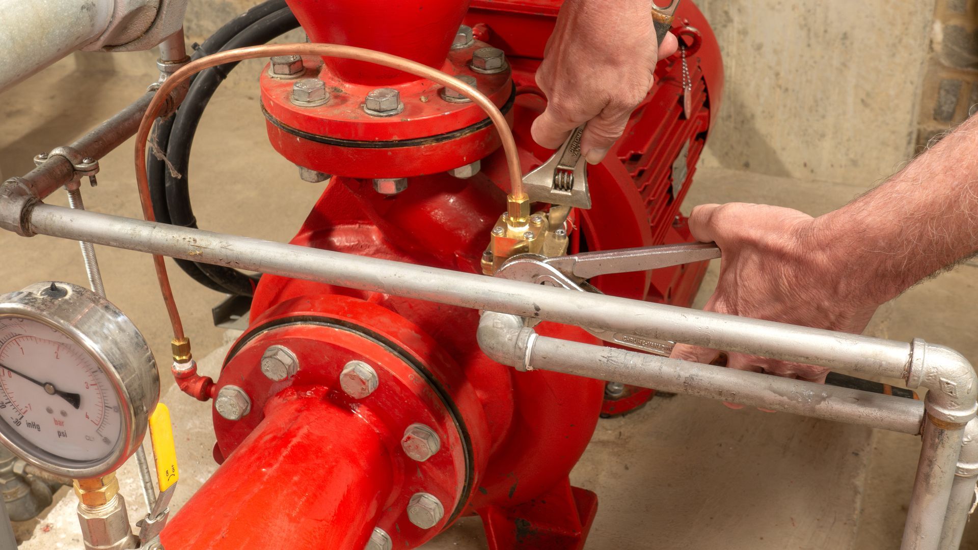 Sprinkler engineer replacing a valve.
