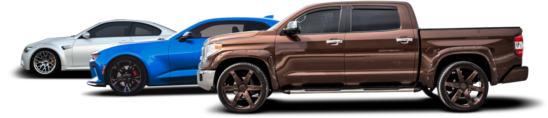 Three pickup trucks in silver, blue, and brown lined up side by side on white background | Mechanic On Duty CB LLC