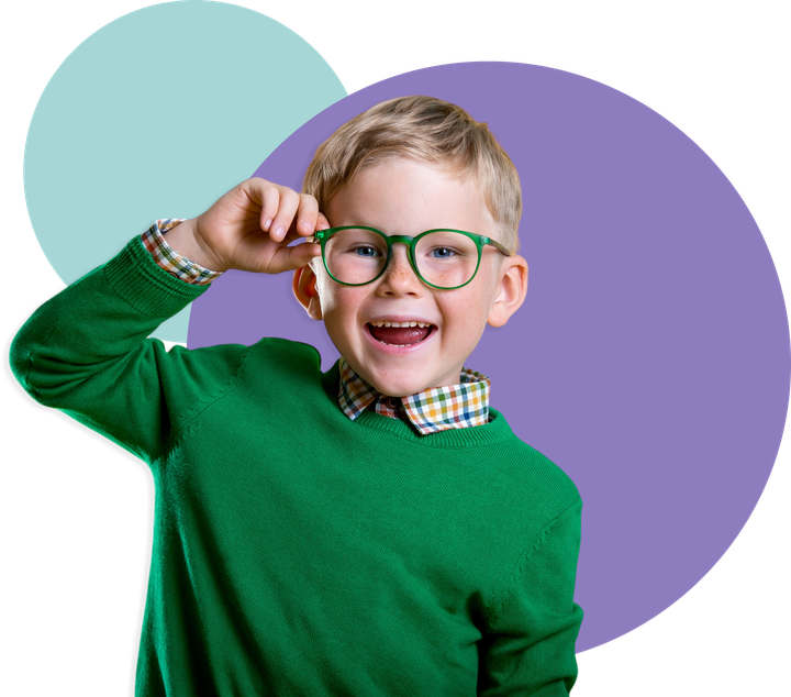 Four smiling children lying on the floor in front of overlapping purple and teal circles