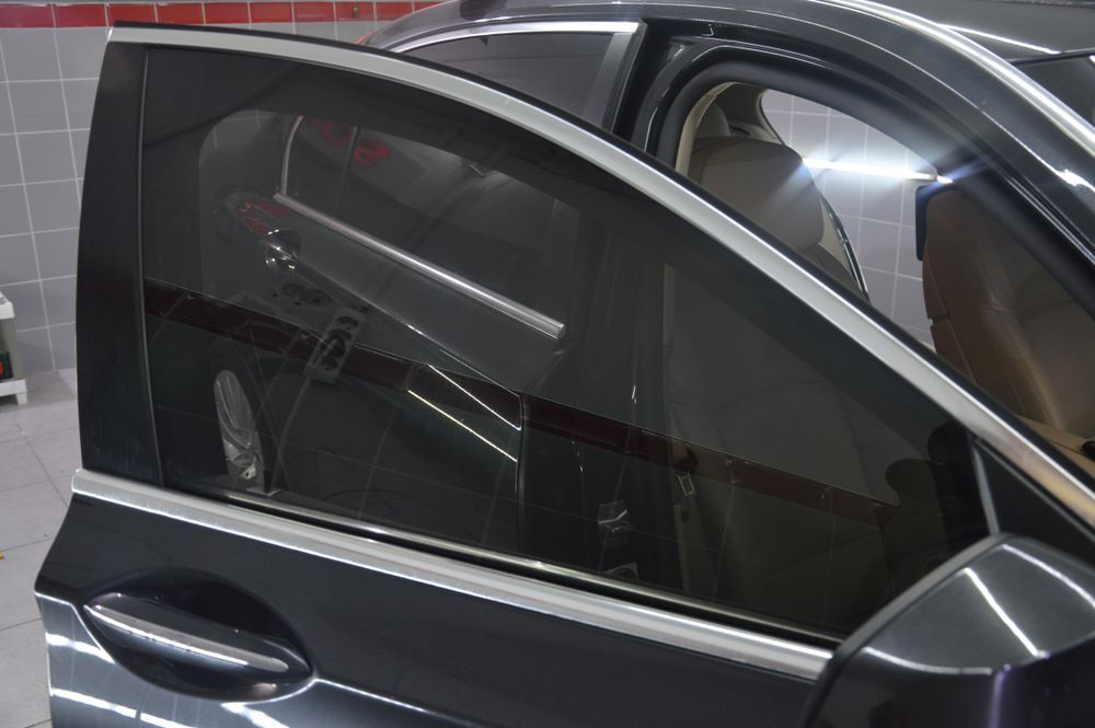 A Car With the Door Open and the Window Closed — A1 CarGlass In Nambour, QLD