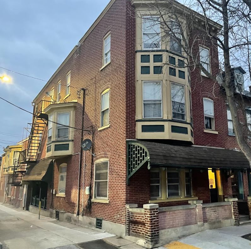 A brick building with a fire escape on the side of it