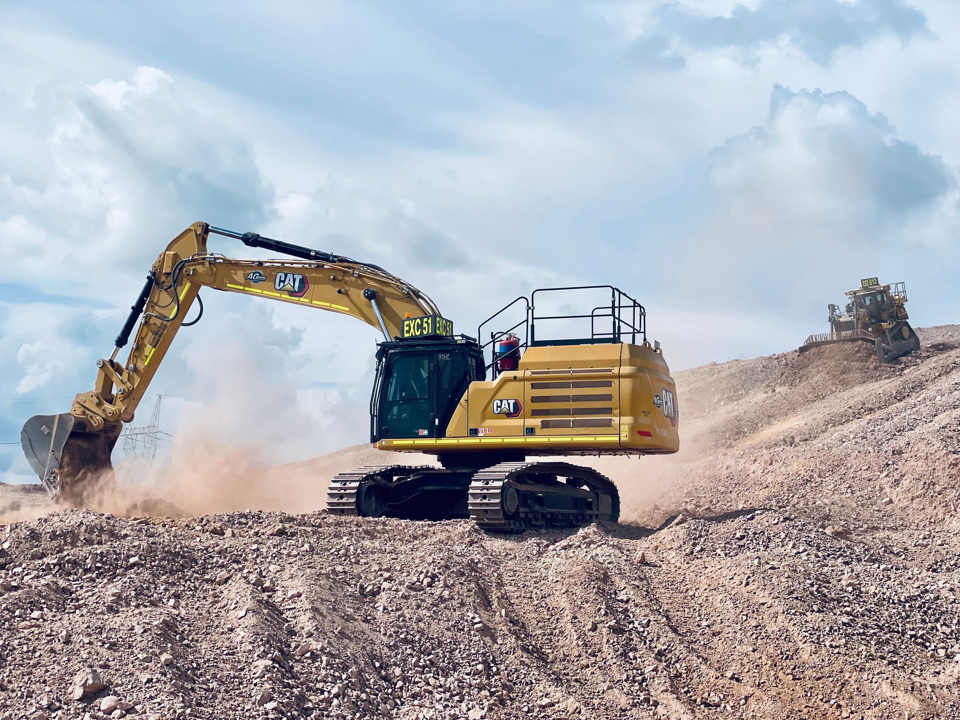Concrete Culvert Under a Fence, Surrounded by Rocks, Trees, and Dirt on a Sunny Day — LS Plant Hire in Calliope, QLD