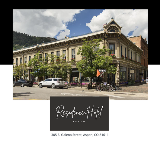 Residence Hotel building in Aspen, Colorado, with storefronts and a logo at the bottom.