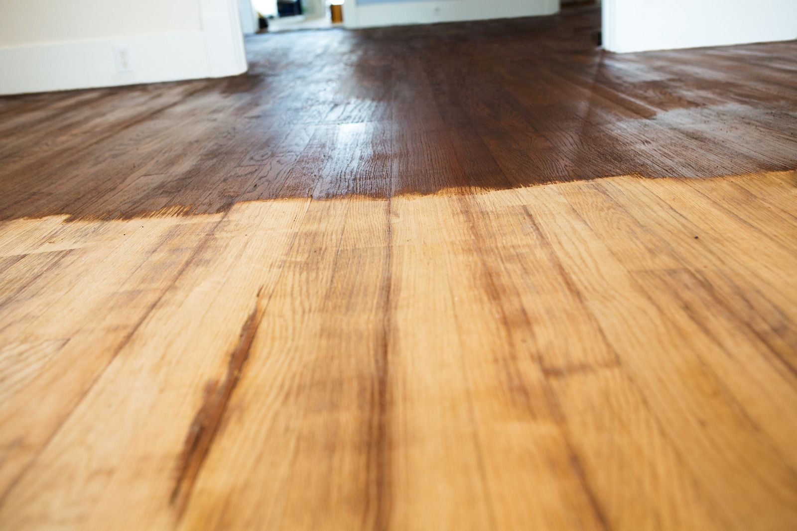 Close-up of a bamboo floor meeting a dark wood floor in a room interior