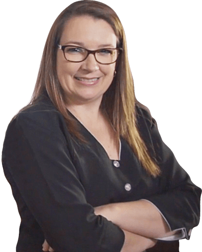 A woman wearing glasses and a black shirt is smiling with her arms crossed.