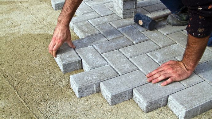 Man Working On Pavement — Portsmouth, VA — Smiley's Masonry Inc.