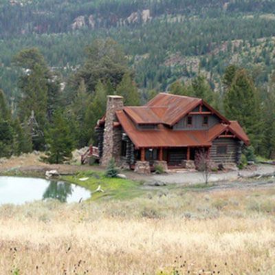 custom Montana log cabin with red roof