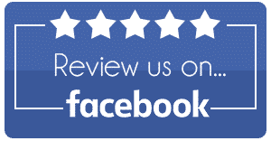 Blue “Review us on Facebook” sign with five white stars at the top.