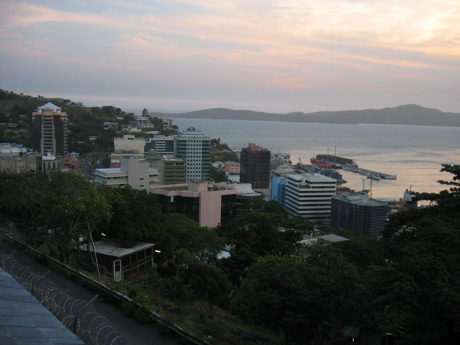 A city with a large body of water in the background