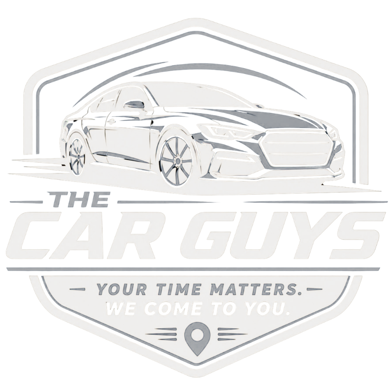 Logo for The Car Guys showing a car in a gray shield with the slogan “Your time matters. We come to you.”