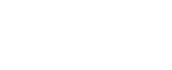 Een overwegend witte, lege afbeelding met een klein rood en donkergrijs vlekje linksboven.