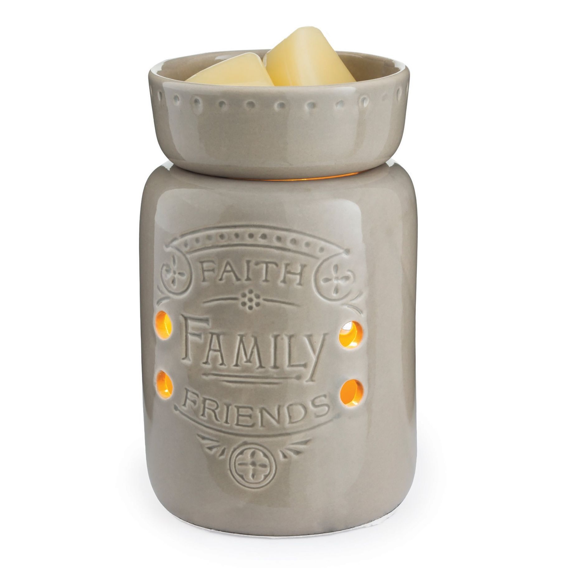 A candle holder with the words faith family friends on it