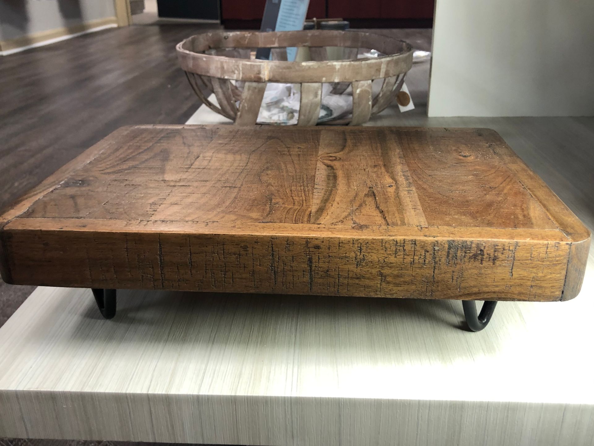 A wooden table with a bowl on top of it.