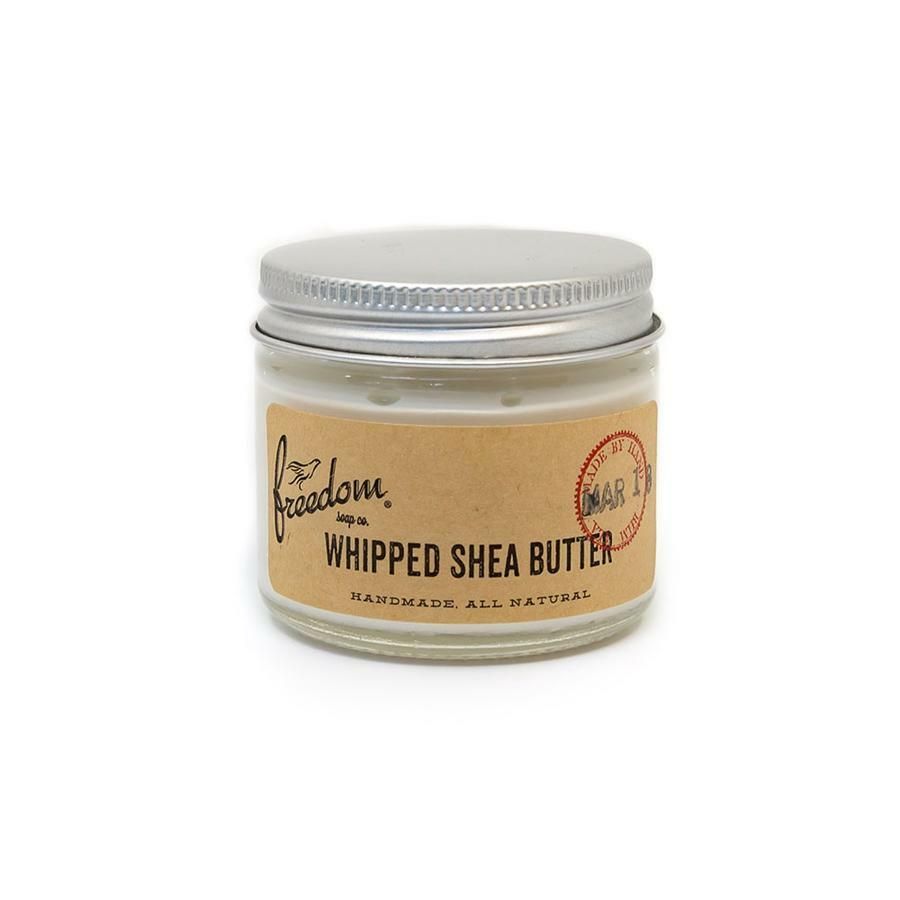 A jar of whipped shea butter with a brown label
