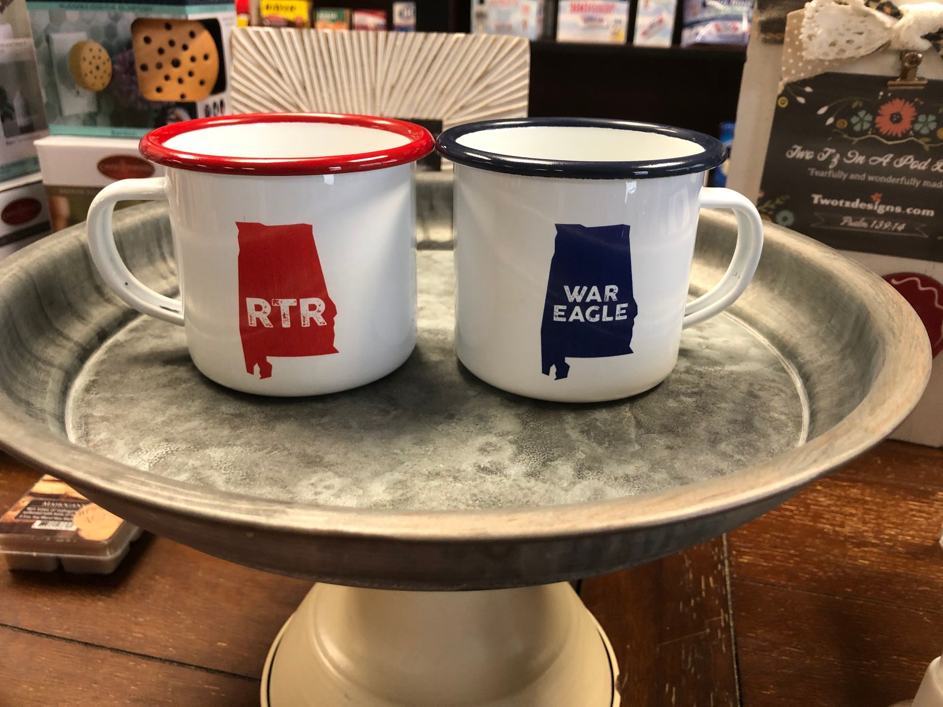 Two coffee mugs with the state of alabama on them