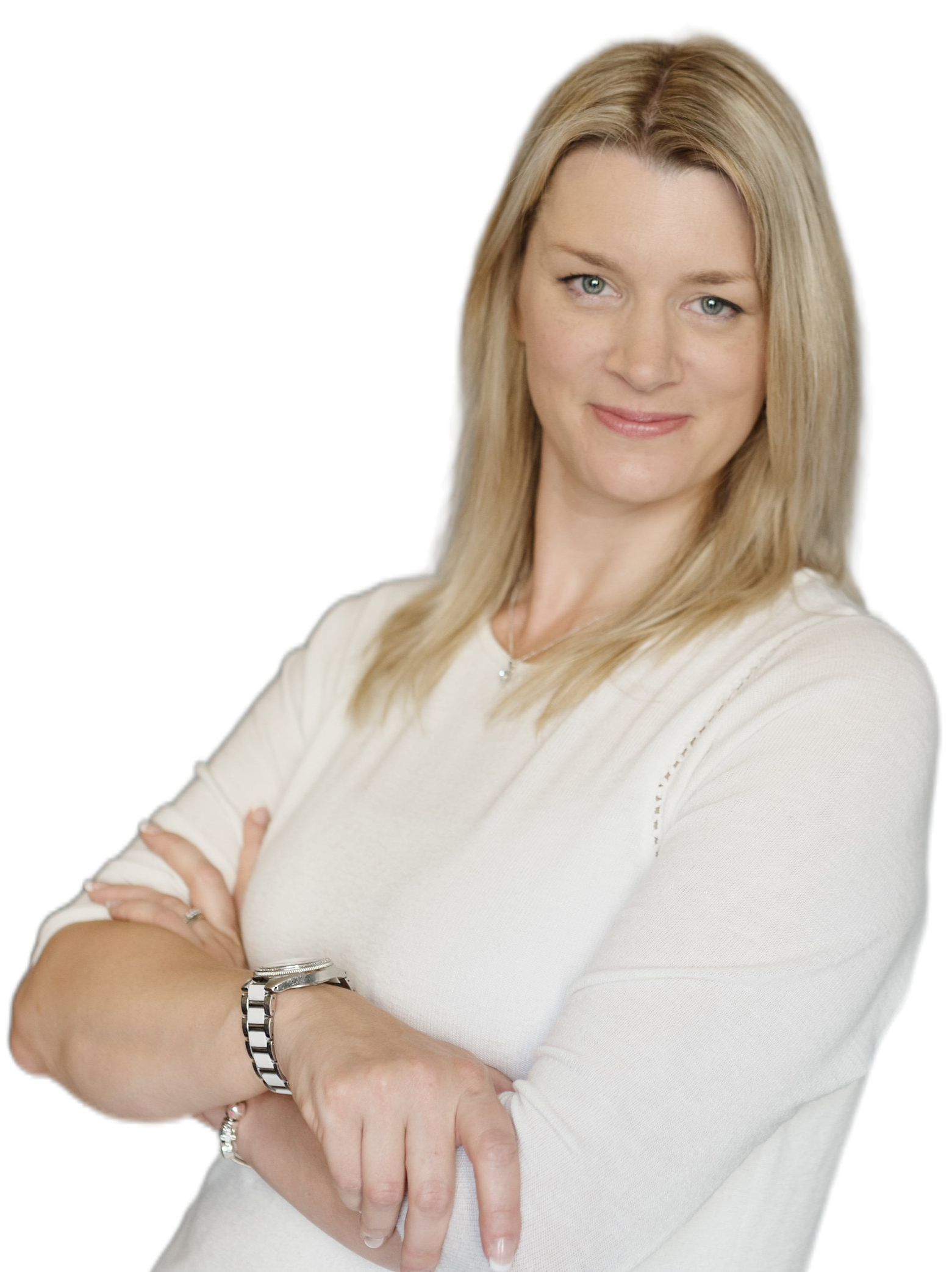 Kelly Owen stands at a desk holding a mobile phone and making notes with her other hand