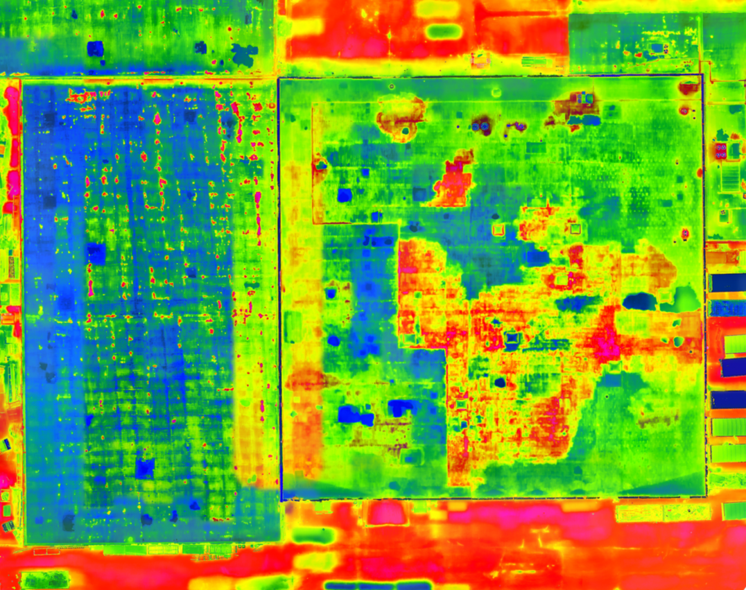Thermal view of a surface with a scattered pattern of warmer orange and yellow against a darker purple.