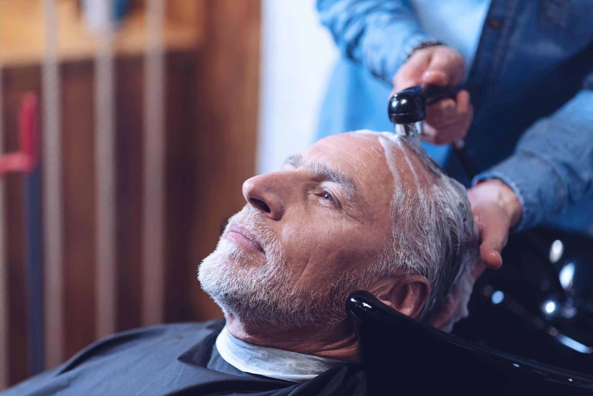 Man getting hair washed