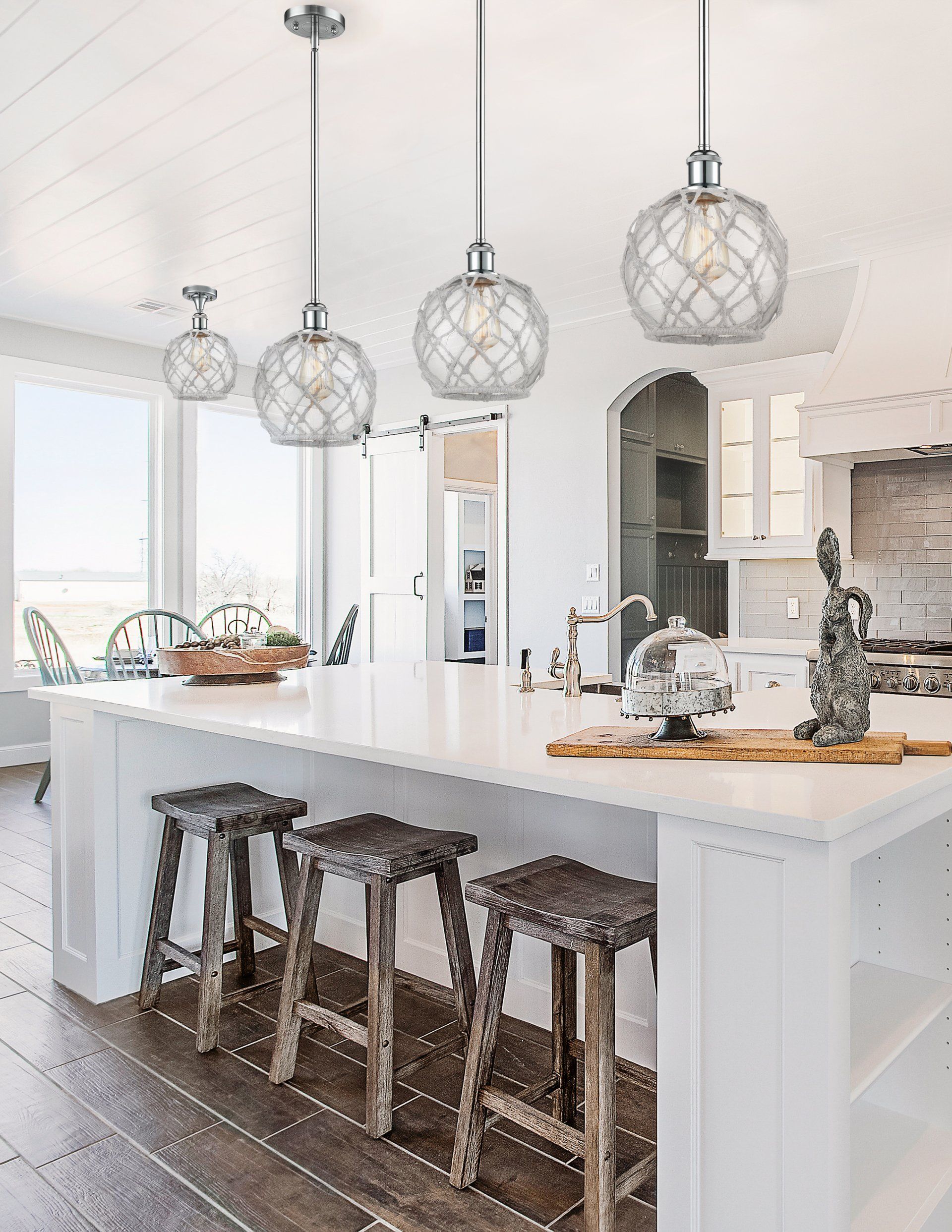 a kitchen with a large island and stools