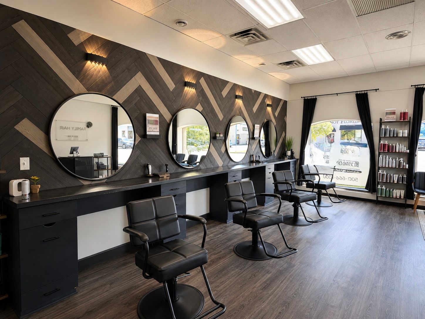 Modern salon interior with styling chairs, round mirrors, and a product display near large windows
