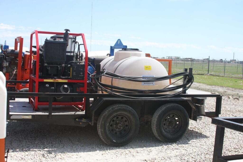 A trailer with a large tank on the back of it
