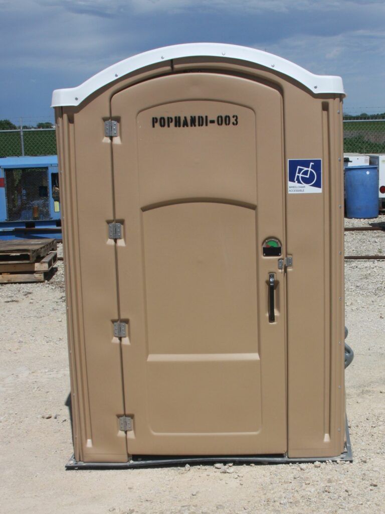 A tan portable toilet with pophambe-003 written on it
